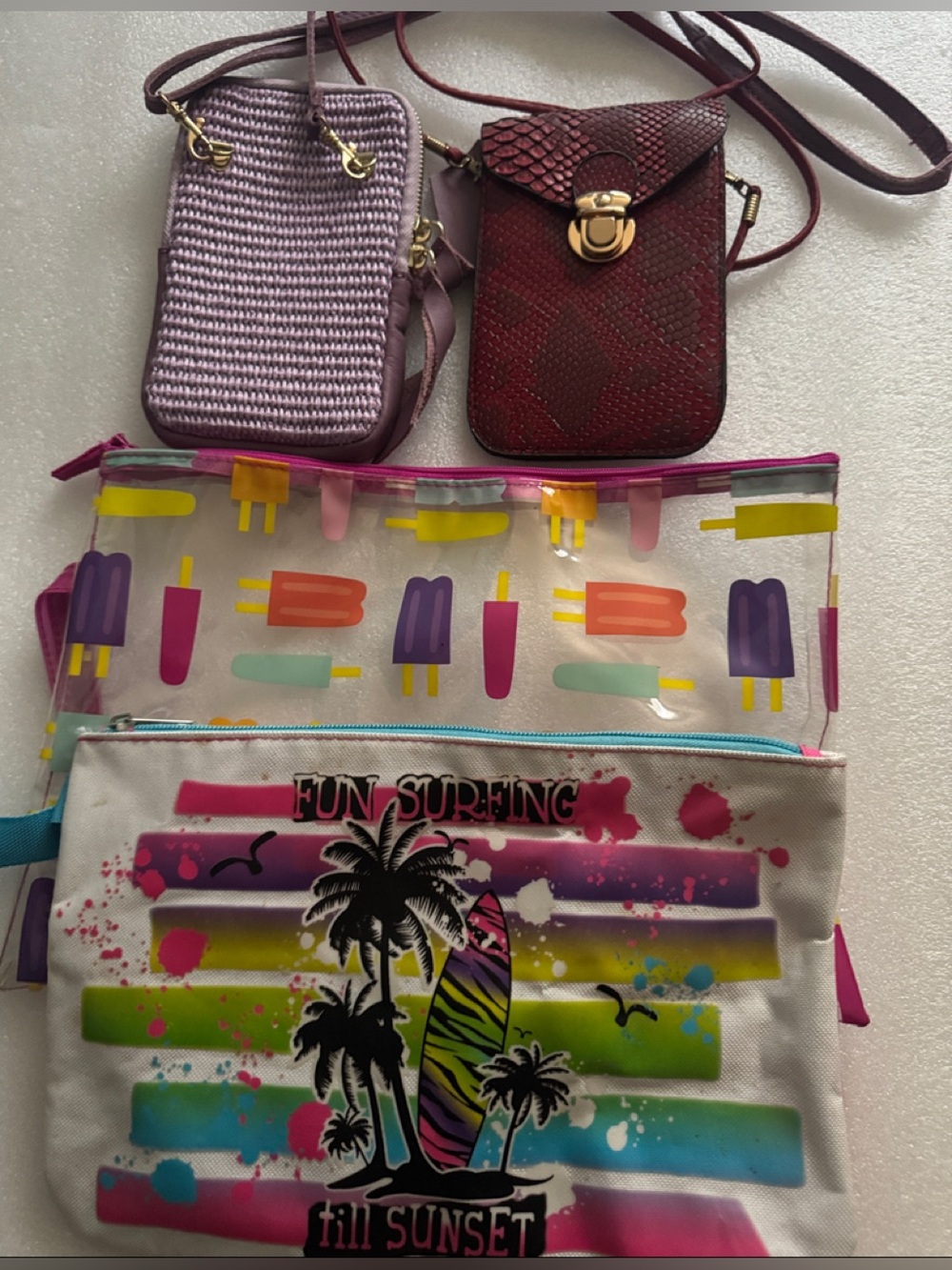 Assorted Crossbody & Pouches in Lavender, Burgundy, Clear, Multi color.